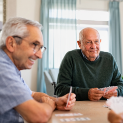 Senior men playing cards