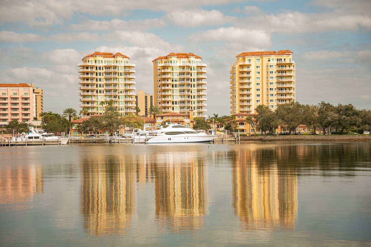 St. Petersburg, Florida - January 31, 2023 Landscape with high-rise buildings on Beach Blvd in downtown of St. Petersburg with water reflections and dramatic skies
