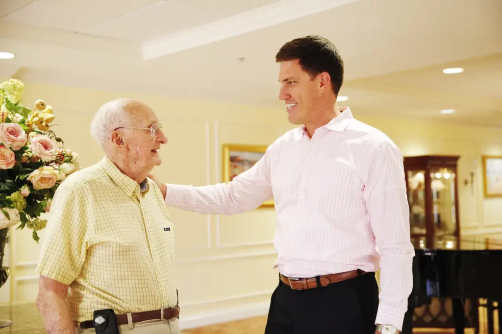 Caregiver talking with senior man