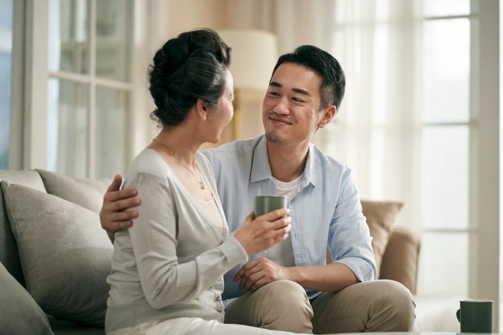 Adult son navigating changed with senior mother