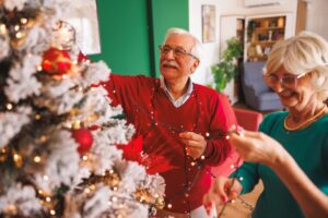 Seniors decorating a Christmas tree