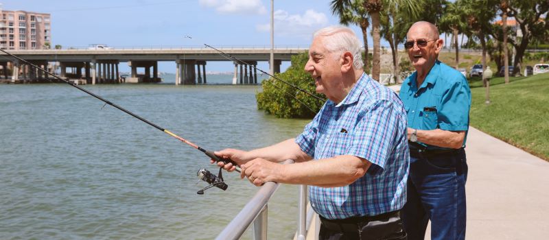 college harbor residents fishing on waterfront